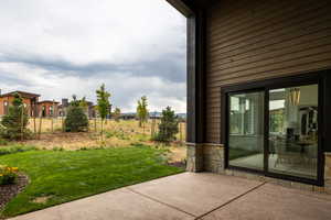 View of yard with a patio