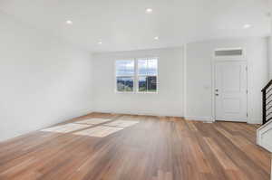 Unfurnished living room featuring light wood-type flooring