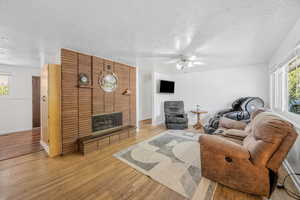 Living room with hardwood floors and gas fireplace