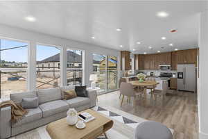 Living room featuring sink and light hardwood / wood-style floors