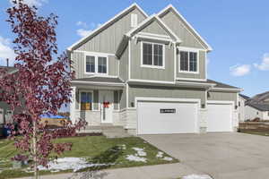 Craftsman inspired home featuring a garage