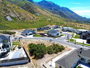 Aerial perspective of suburban area featuring a mountain backdrop