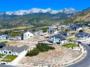 Aerial perspective of suburban area featuring a mountain backdrop