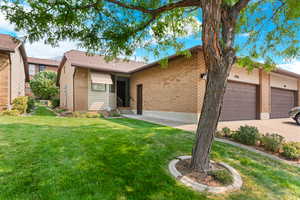 Ranch-style home featuring a front yard