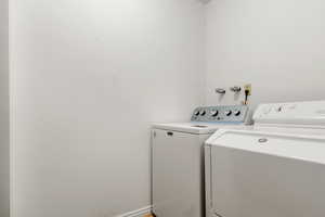 Washroom featuring separate washer and dryer