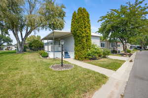 View of side of property with a yard