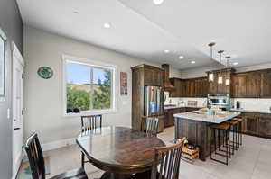 Tiled dining space with sink