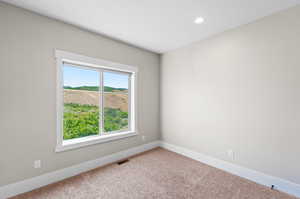 Unfurnished room with carpet floors