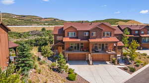 View of front facade featuring a garage