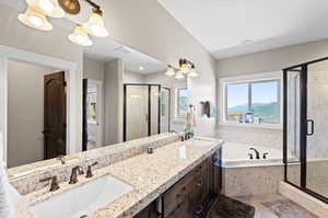 Bathroom with a mountain view, vanity, independent shower and bath, and tile patterned flooring