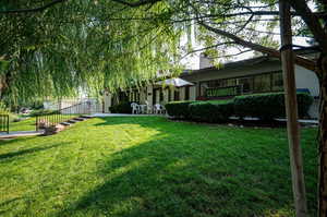 View of Clubhouse with large yard