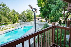 View of swimming pool and deck area from view of this unit