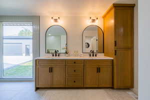 Bathroom with vanity and tile patterned flooring