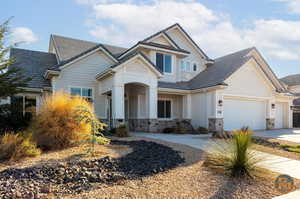 Craftsman inspired home with a garage and covered porch