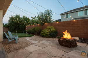 View of patio / terrace with an outdoor fire pit