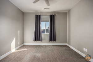 Bedroom - 5 - Carpeted spare room featuring ceiling fan