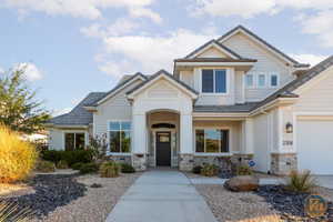 Craftsman inspired home with a porch and a garage