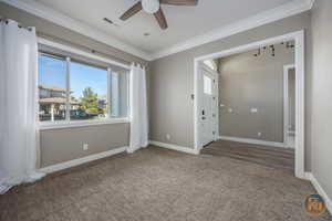 Office/Living Room with view toward entryway with ceiling fan, ornamental molding, and wood-type flooring