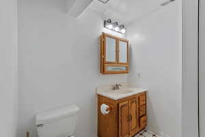 Basement 3/4 Bathroom featuring vanity and toilet. Shower