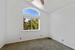 Bedroom #2 upstairs.  Vaulted ceiling, ceiling fan, and carpet floors