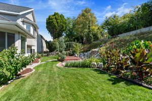 View of yard featuring a balcony