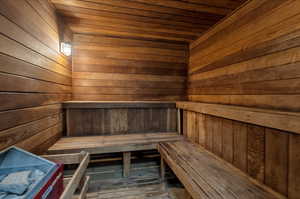 2nd Floor. View of sauna / steam room featuring wood ceiling, hardwood / wood-style flooring, and wood walls