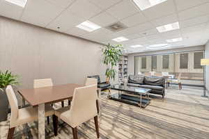 2nd Floor.Dining area with wood-type flooring and a drop ceiling