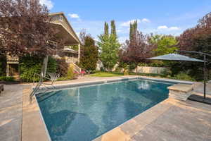 View of swimming pool featuring a patio area