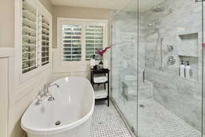 Master bathroom featuring separate shower and tub