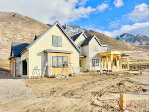 Rear view of property featuring a mountain view