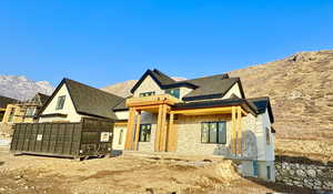 View of front of home featuring a mountain view