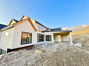 Rear view of property with a mountain view