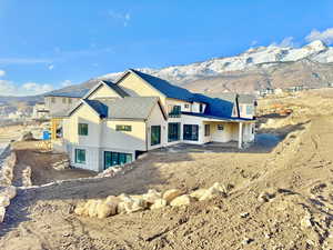 Rear view of house with a mountain view