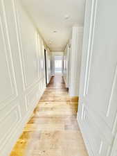 Hallway featuring light wood-type flooring