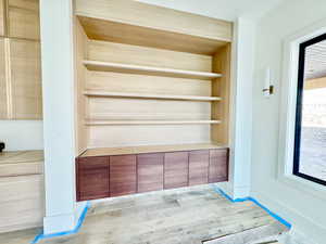 Room details featuring wood-type flooring and built in features