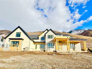 View of front of house featuring a mountain view