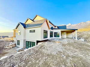 Back of property with a mountain view