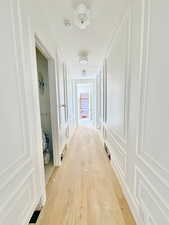 Corridor featuring light hardwood / wood-style floors