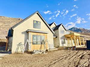 Rear view of house with a mountain view