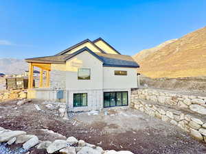 Back of house featuring a mountain view