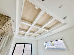 Room details with coffered ceiling and beamed ceiling