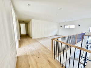 Hall featuring light hardwood / wood-style flooring