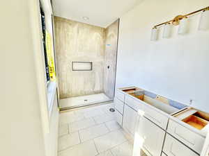 Bathroom with a tile shower