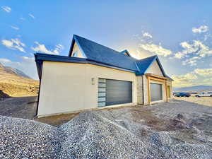 View of side of property with a mountain view