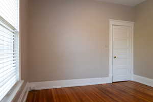 Spare room with wood-type flooring