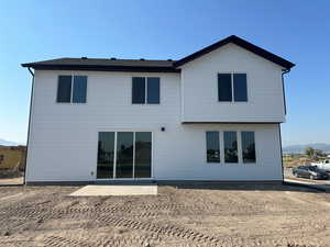 Rear view of house featuring a patio area