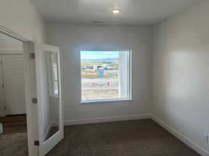 View of carpeted spare room