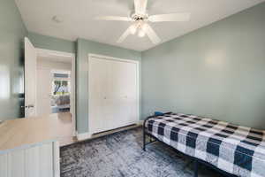 Bedroom with a closet and ceiling fan