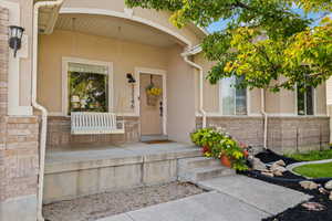 Entrance to property featuring a porch