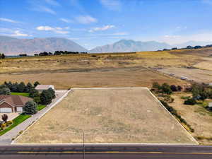 Birds eye view of property featuring a mountain view and a rural view